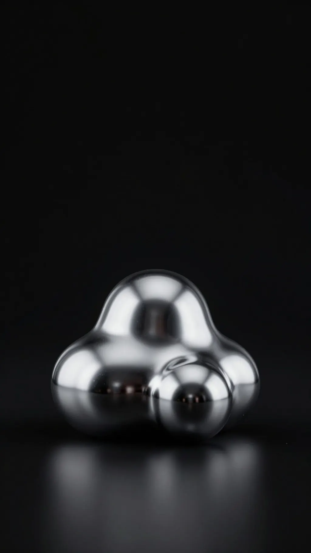 Liquid chrome blob on a plain black background, soft studio reflections, sitting low in the frame
